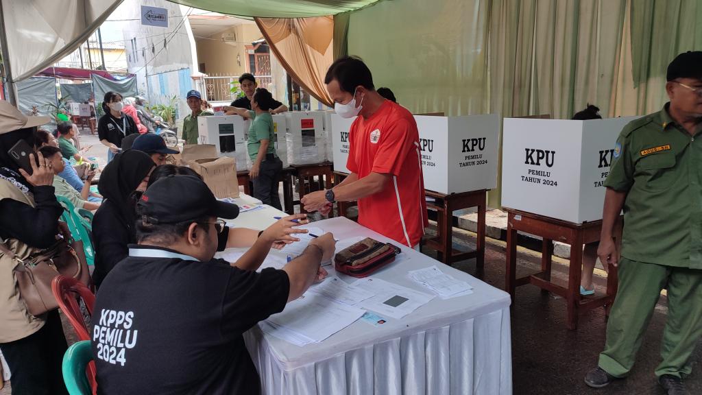A picture of polling booth with election officials working during elections in Indonesia  