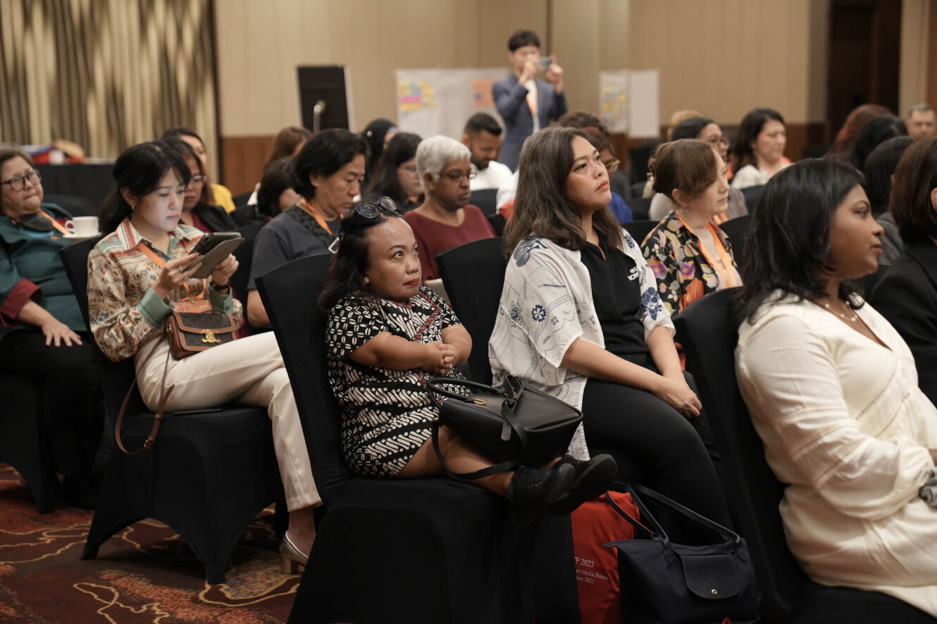 Audience members listen attentively