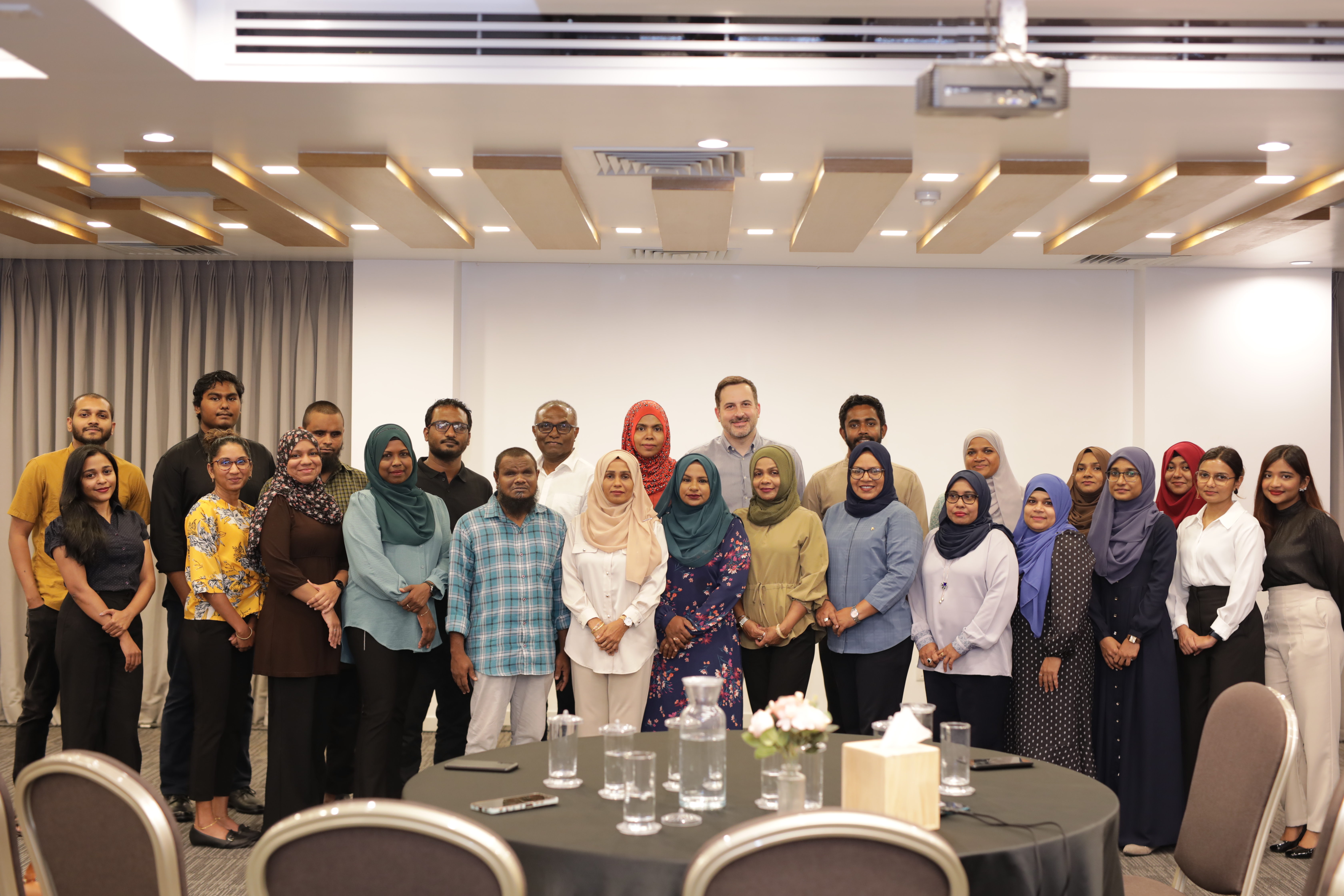A group photo of CSO members participating in an event in Maldives 