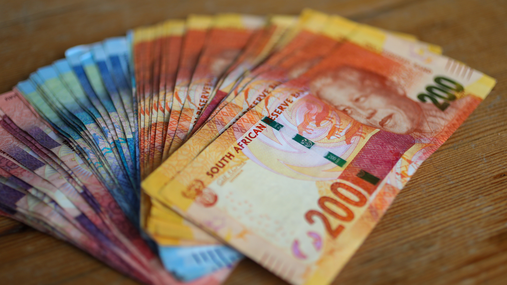 A picture displaying South African currency in notes